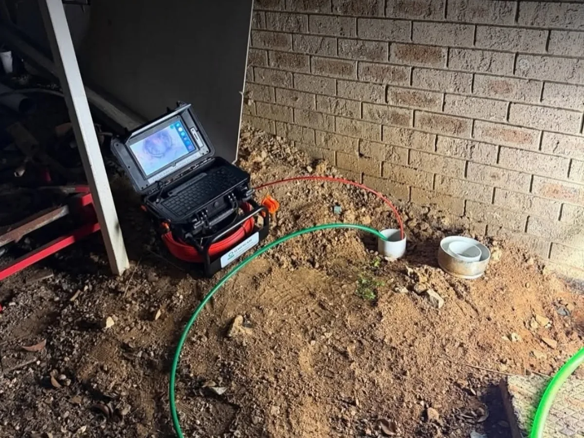CCTV drain inspection equipment set up near a Queanbeyan drain access point