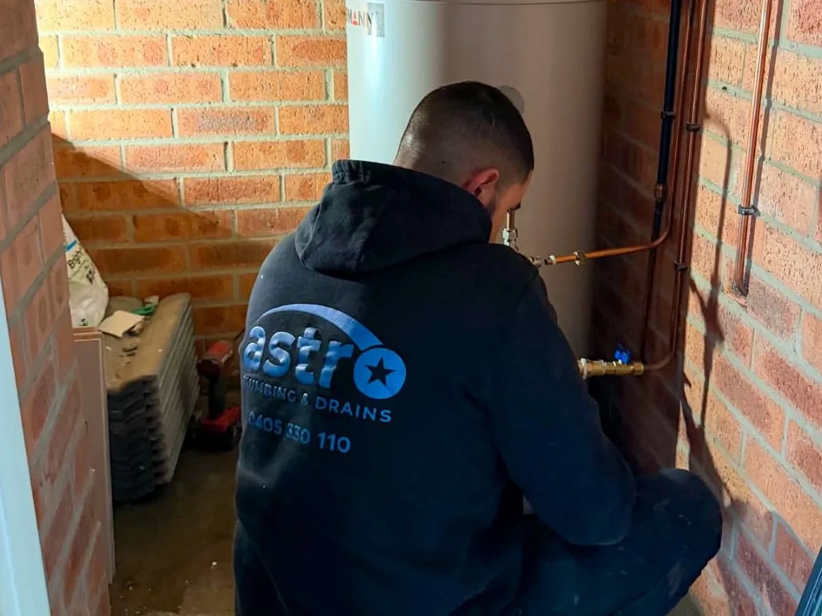 Astro plumber completing an urgent pipe repair