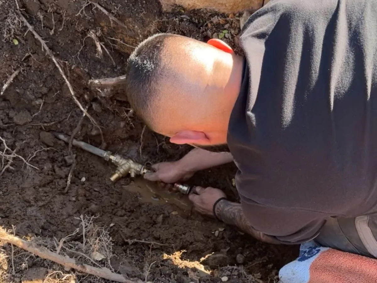 Underground burst water pipe being repaired